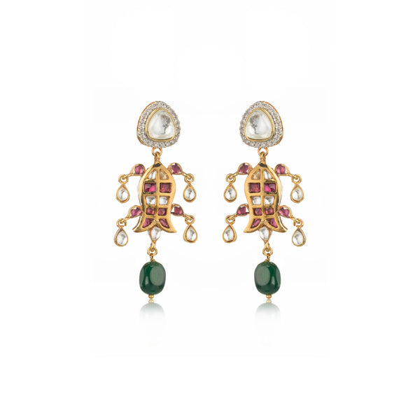 Pair of gold Anika Earrings with fish motifs, featuring pink, green, and white stones, on a white background with reflection