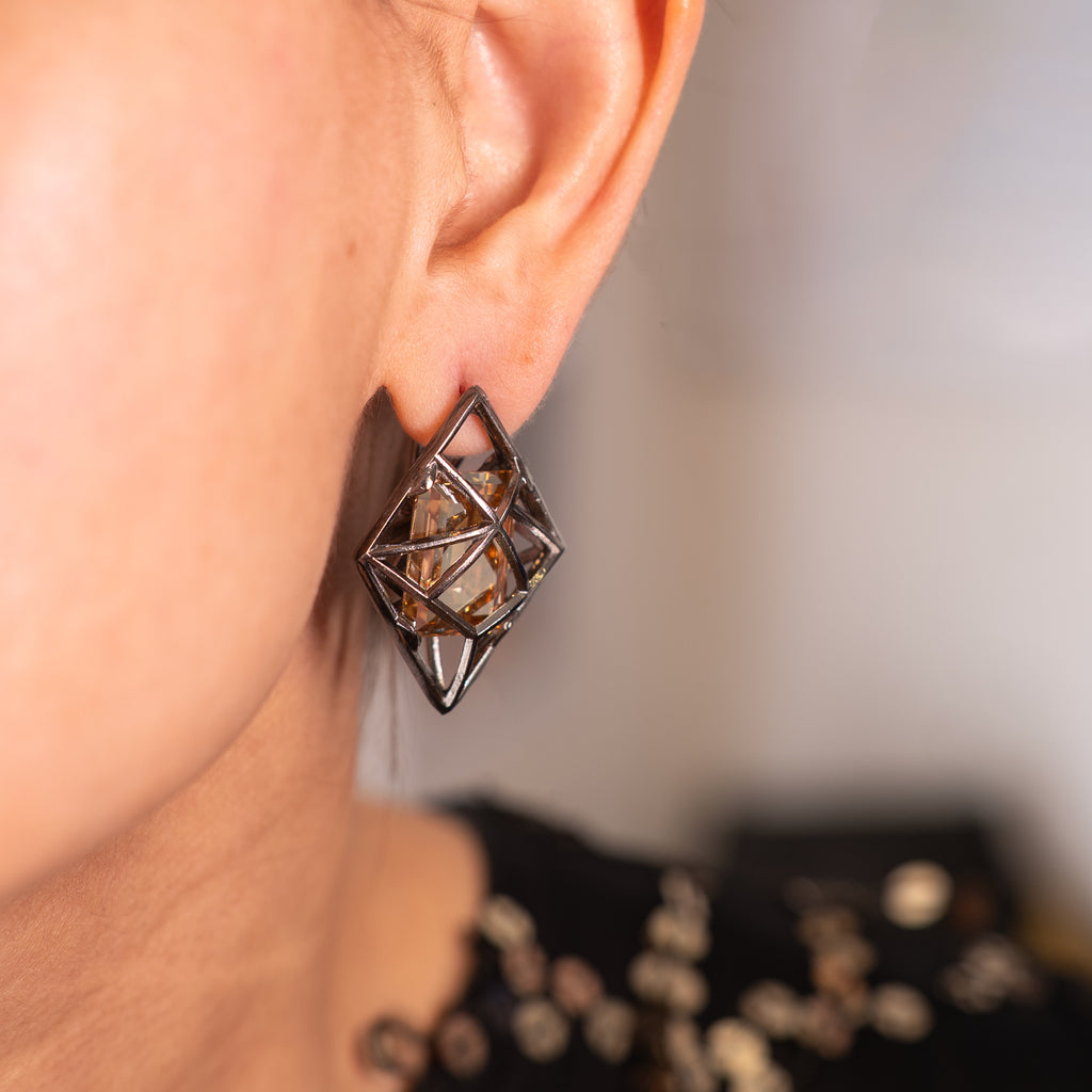 Allure Swarovski Earrings dangling on an ear