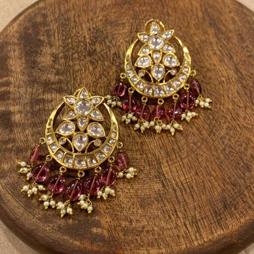 Hazrat Chandbaali With Pink Drops is displayed on a wooden block 