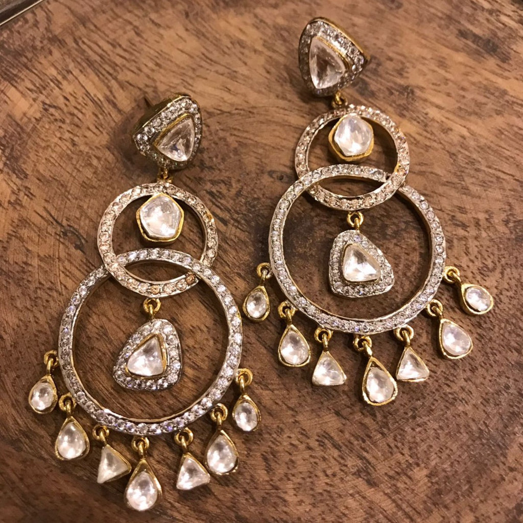 Erina Earrings with round rings, vibrant stones, and suspended kundan droplets, showcasing traditional craftsmanship