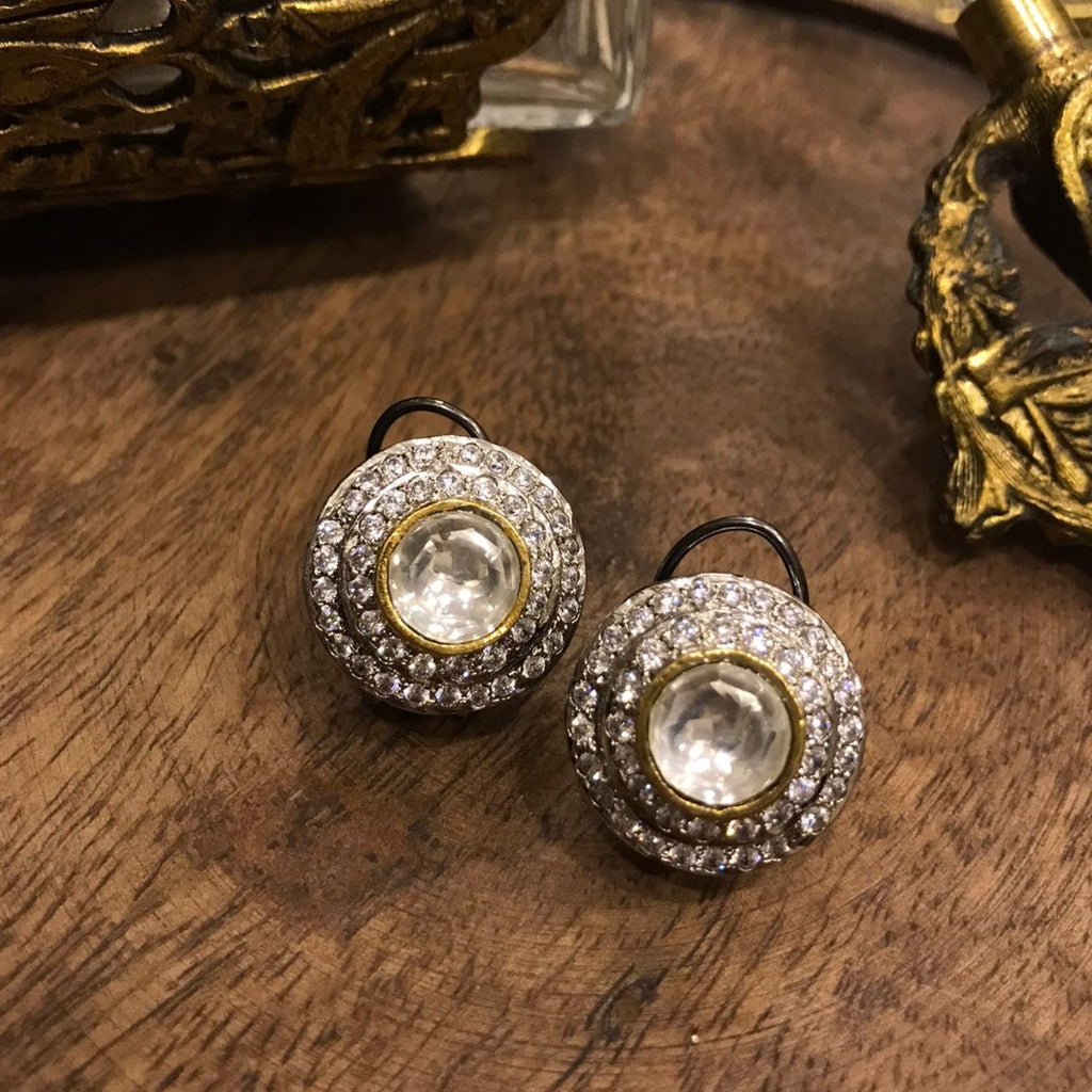 Noor Kundan Stud Earrings with a Kundan centerpiece, haloed by sparkling stones, exuding opulence and captivating allure