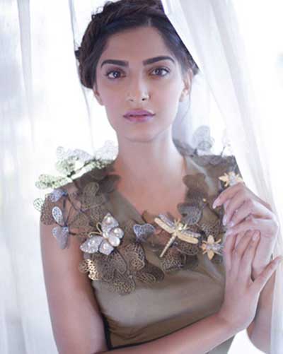 Famous actress Sonam Kapoor is posing with western dress