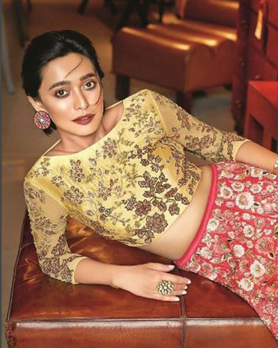 Featuring Sayani Gupta, posing with designer round earrings