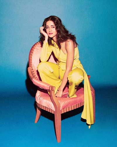 Actress Ananya Pandey is posing with a designer necklace and western outfit